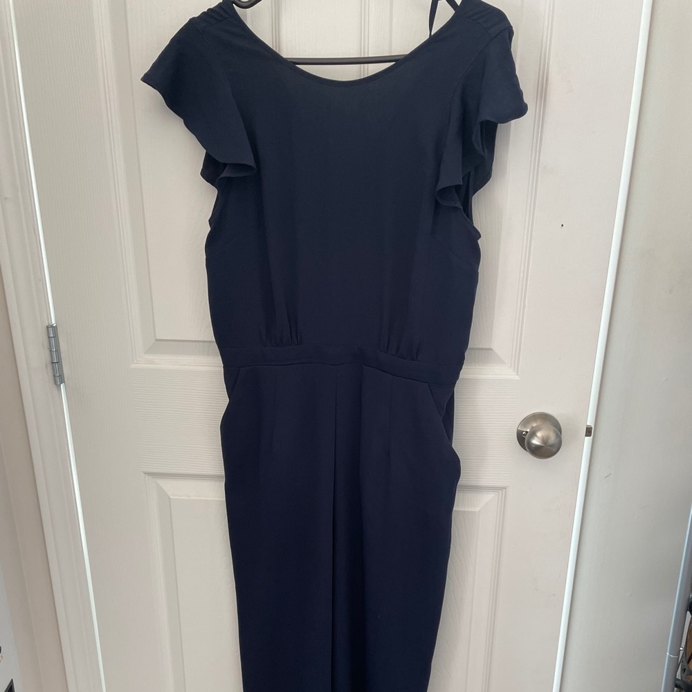 Wide leg jumpsuit with flutter sleeves.